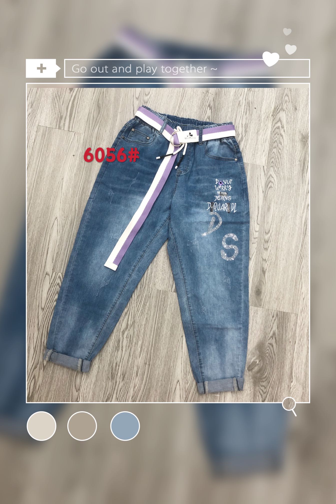 Denim sample 01: blue jeans with a contrasting belt and lettering