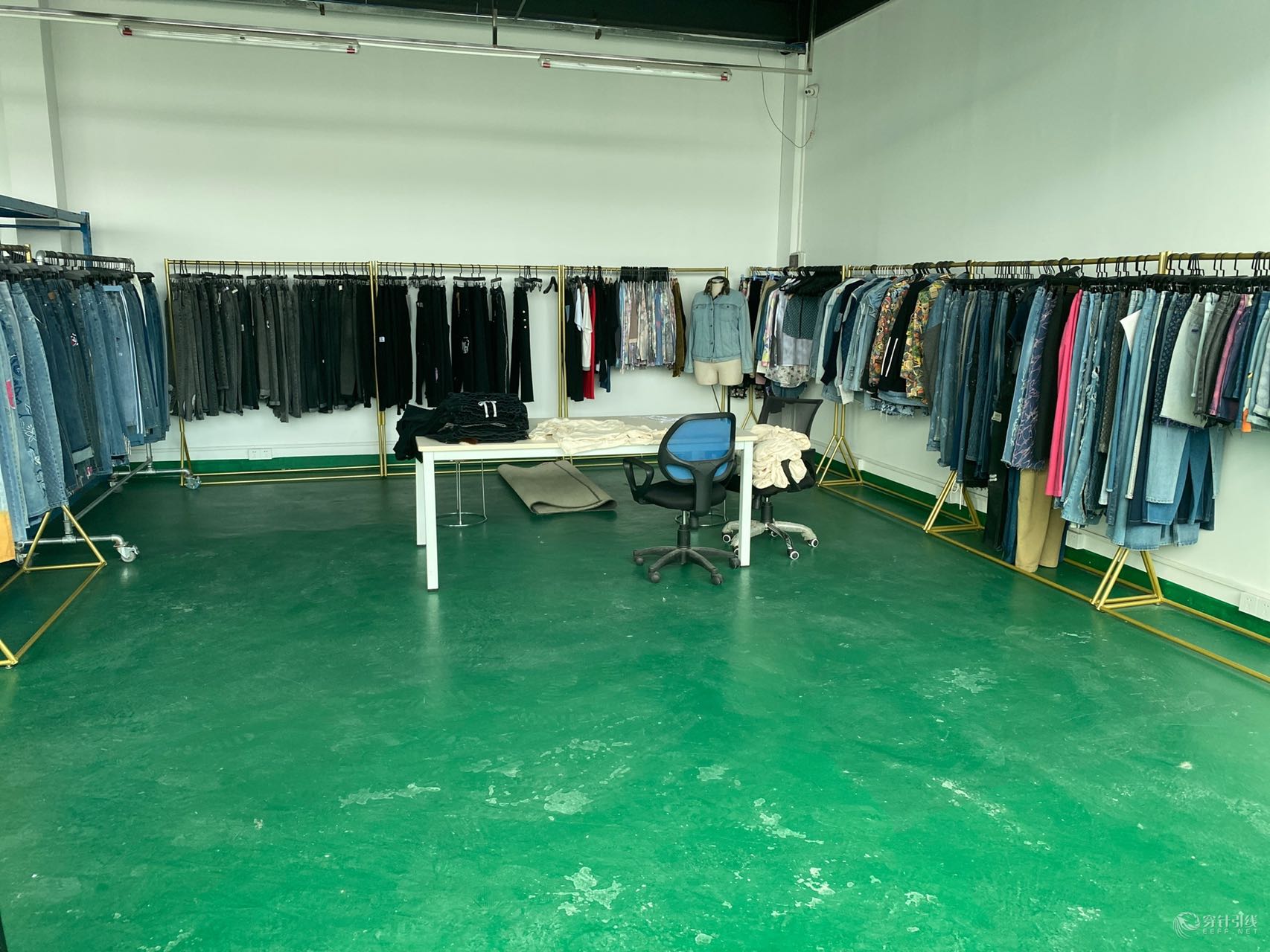 Second view of the showroom showing additional denim samples